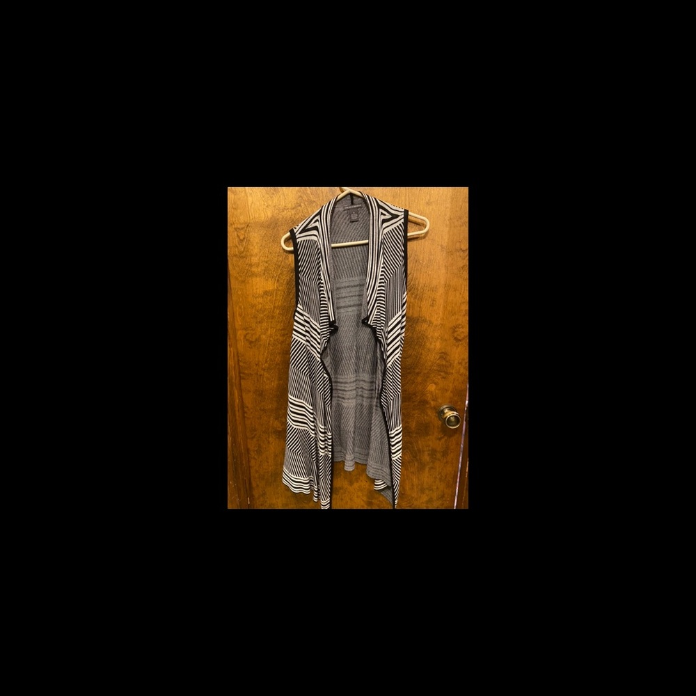 Long cardigan. Black and white striped. Size medium. Good condition
